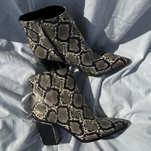 Circus faux snakeskin chunky heel boots with metallic silver accents.